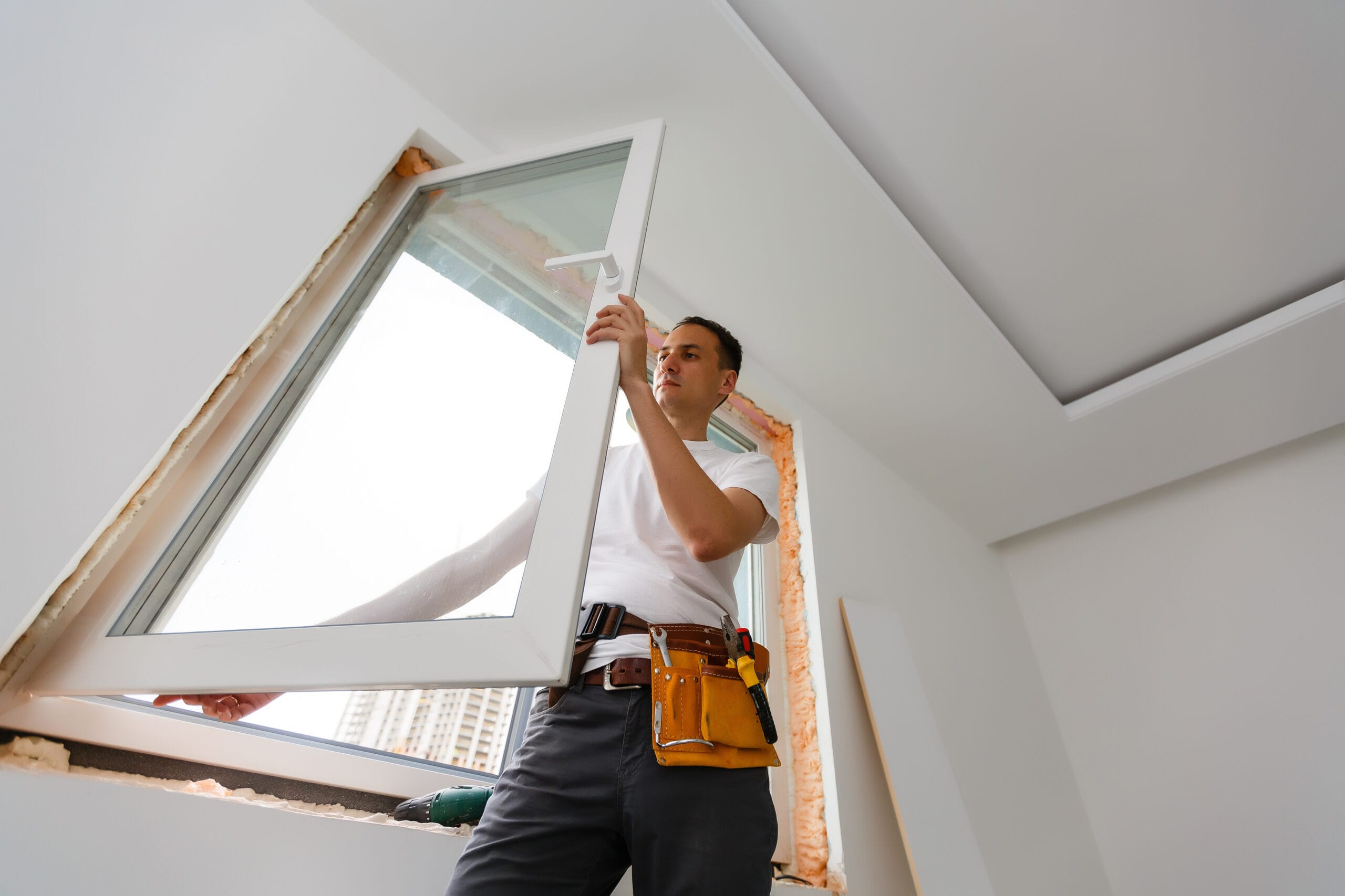 young-handyman-repair-window-with-screwdriver-stockpack-adobe-stock Young handyman repair window with screwdriver